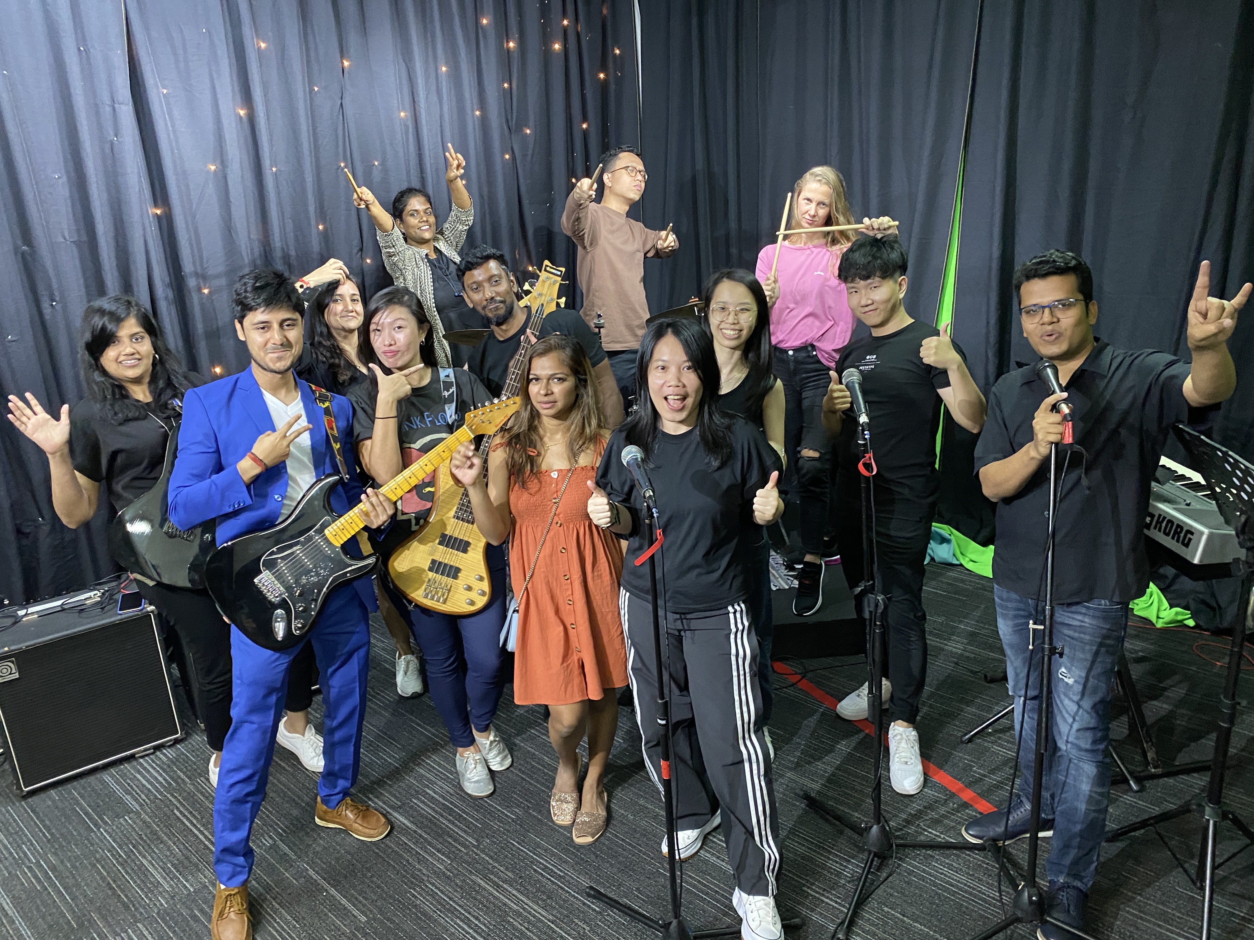 AI Palette team members celebrating together with instruments and microphones
